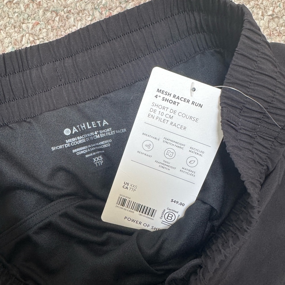 Black Athleta mesh racer run 4’’ shorts in size xxs